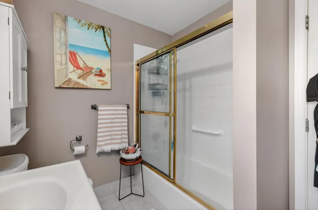 a bathroom with a bathtub and a toilet