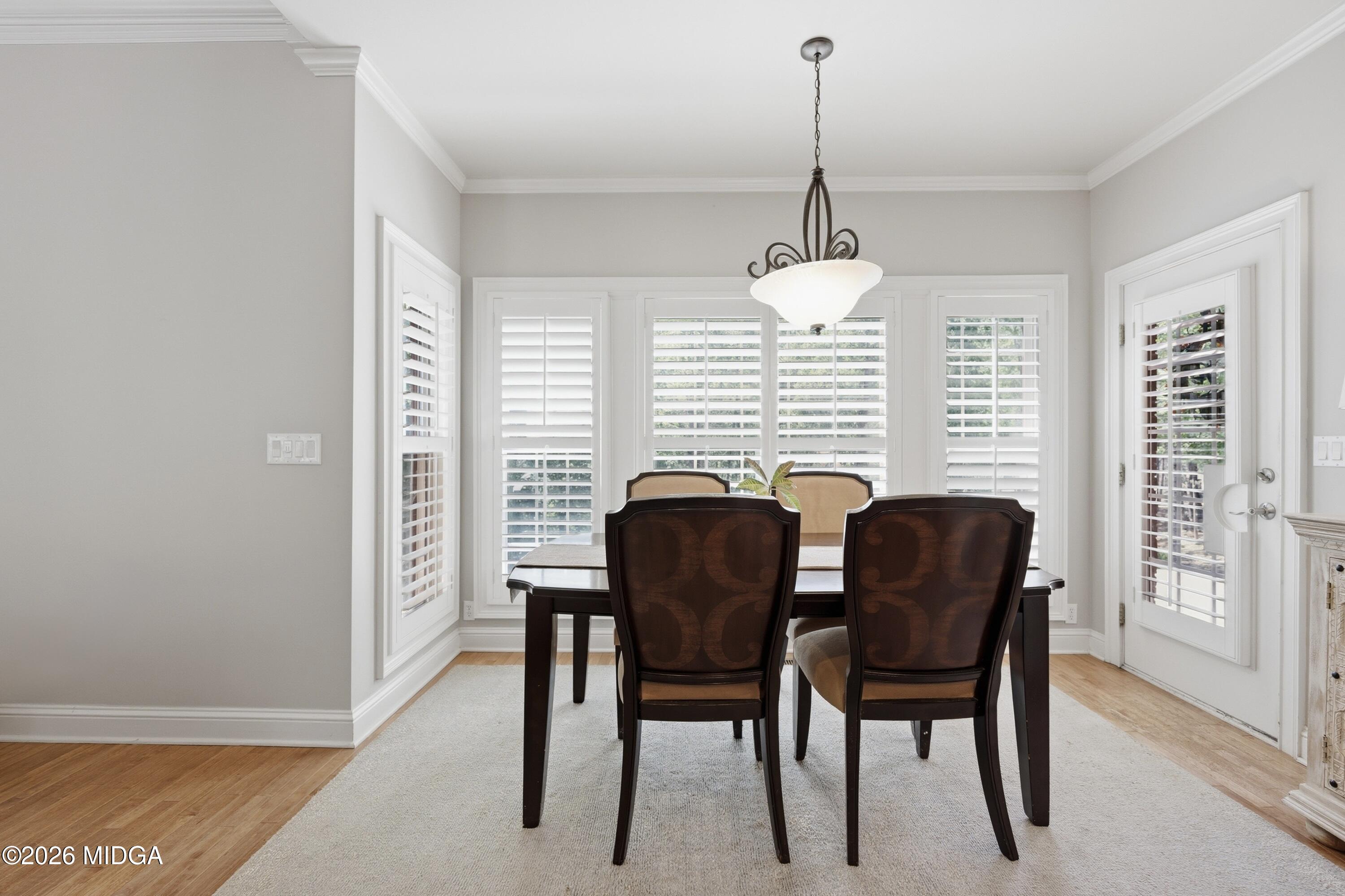102 Tee Drive Forsyth, GA 31029 - Photo 12 of 53 a dining room with furniture and window