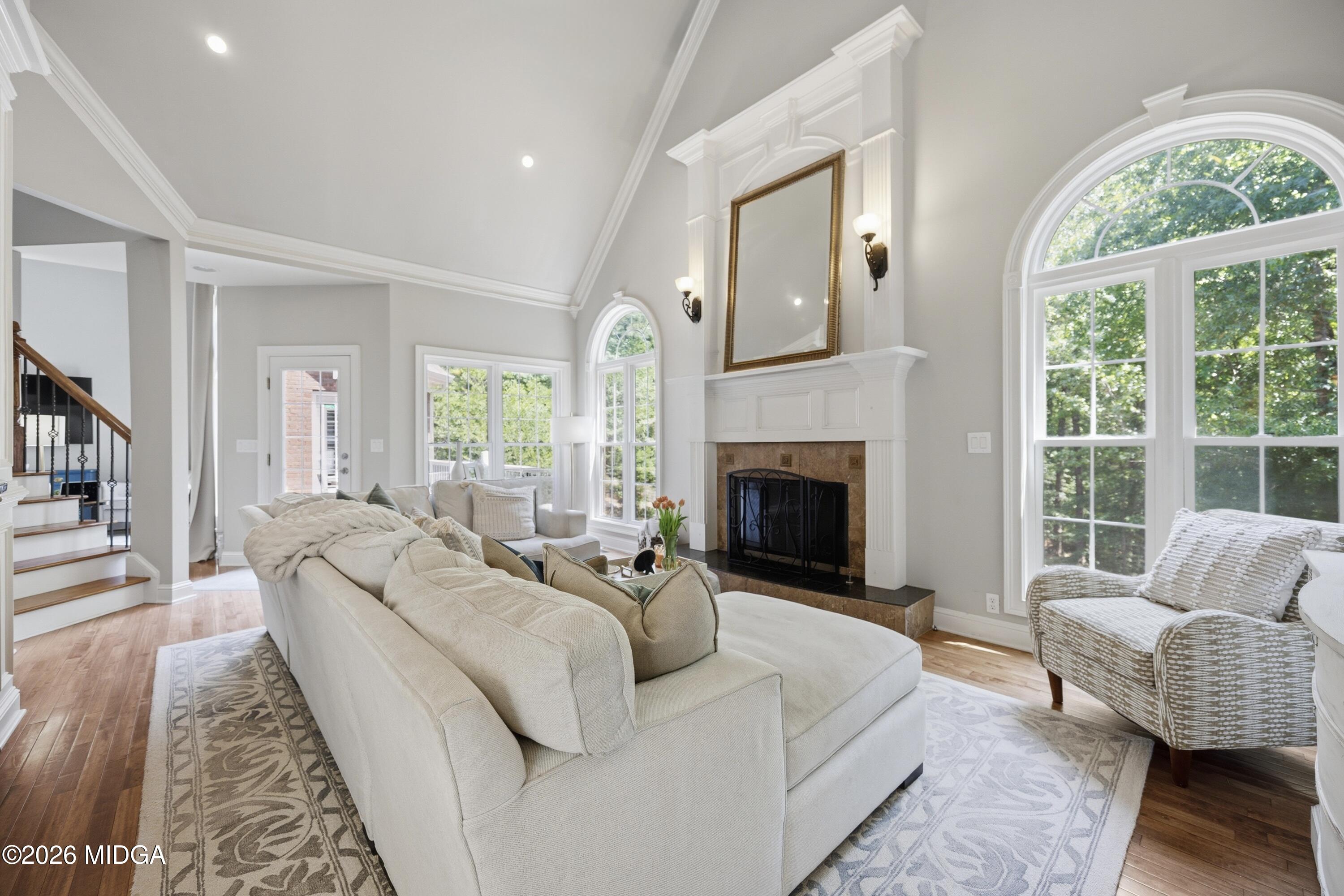 102 Tee Drive Forsyth, GA 31029 - Photo 14 of 53 a living room with furniture a large window and a fireplace