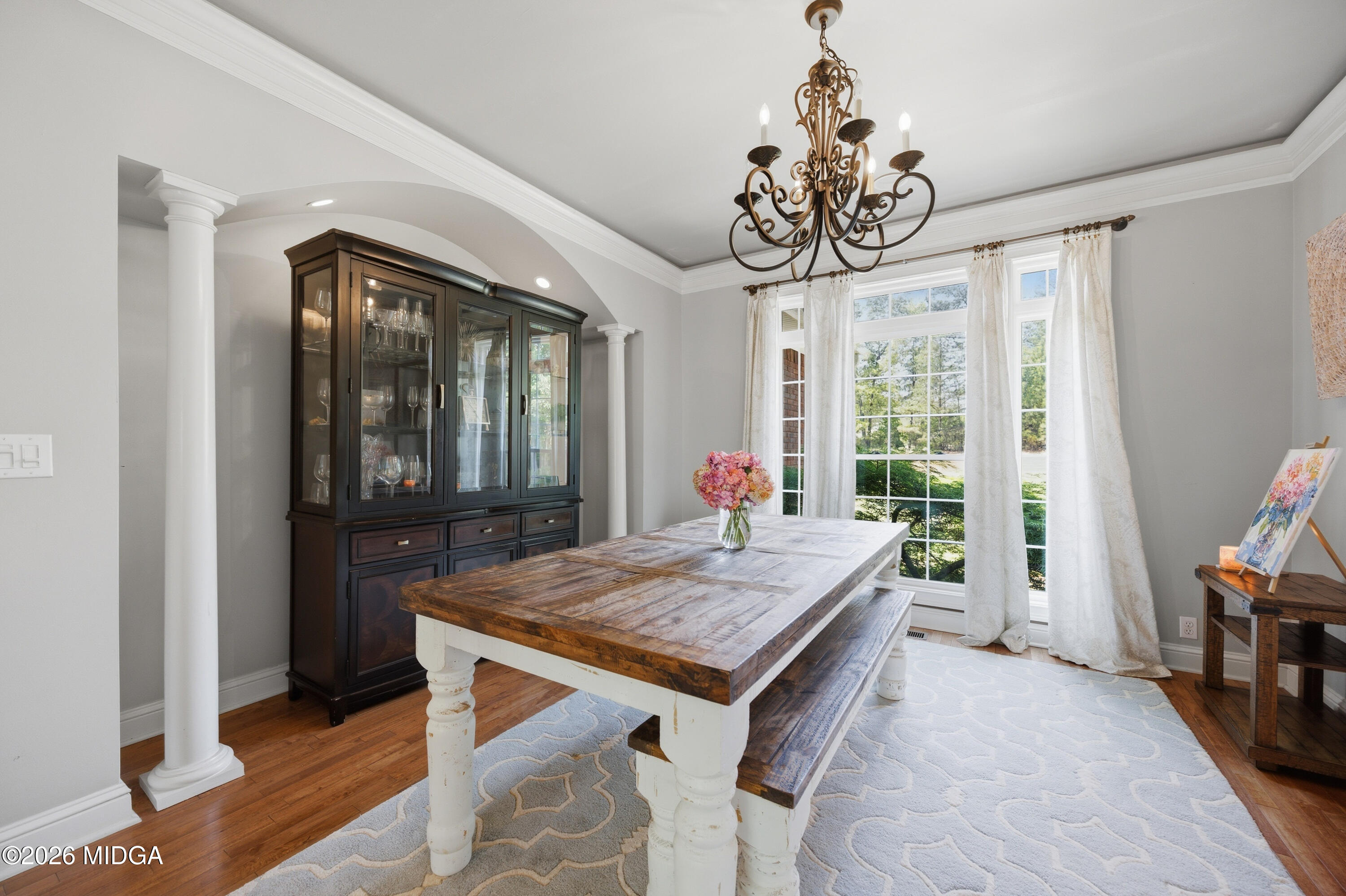 102 Tee Drive Forsyth, GA 31029 - Photo 21 of 53 a view of a dining room with furniture window and wooden floor