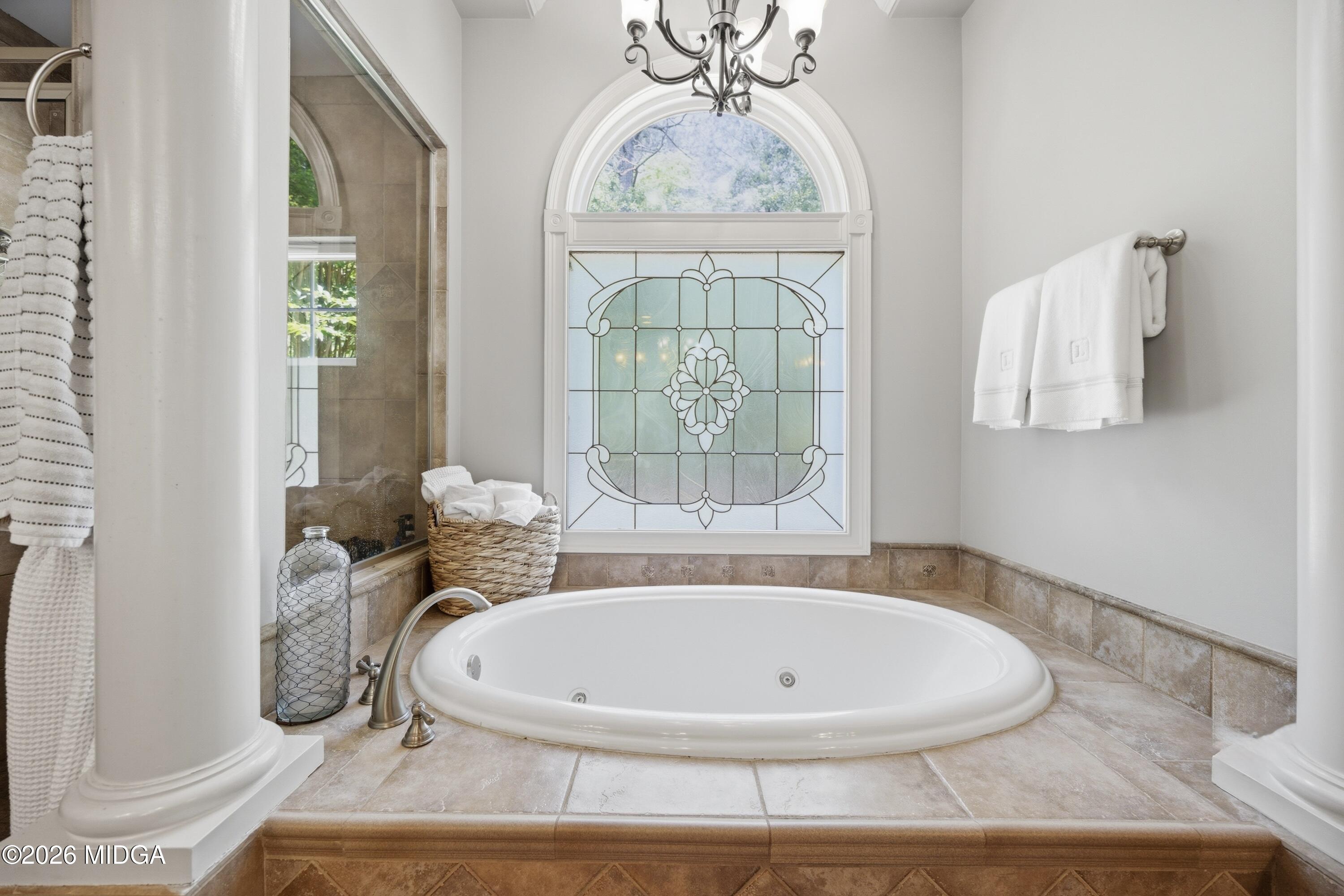 102 Tee Drive Forsyth, GA 31029 - Photo 30 of 53 a view of a bathroom with a tub and window