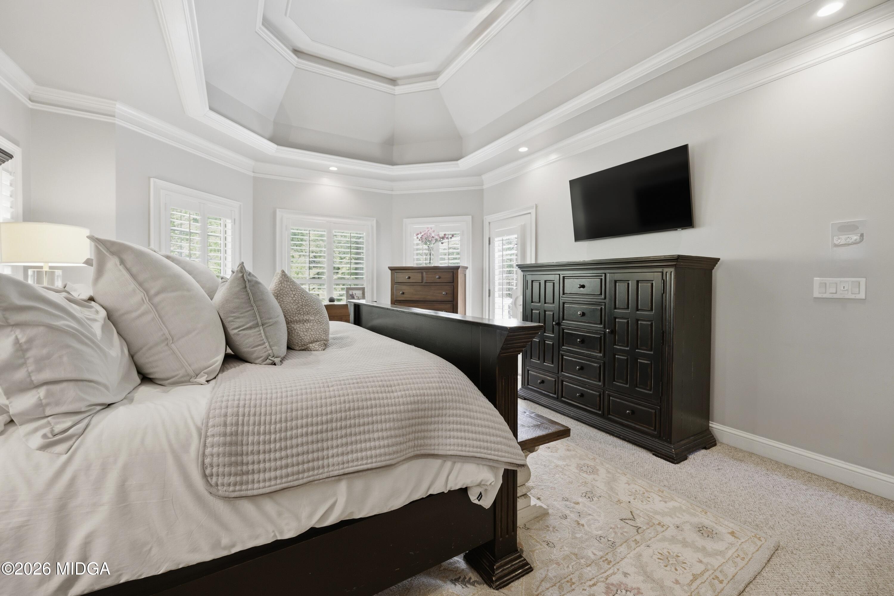 102 Tee Drive Forsyth, GA 31029 - Photo 32 of 53 a bedroom with a bed and a flat screen tv