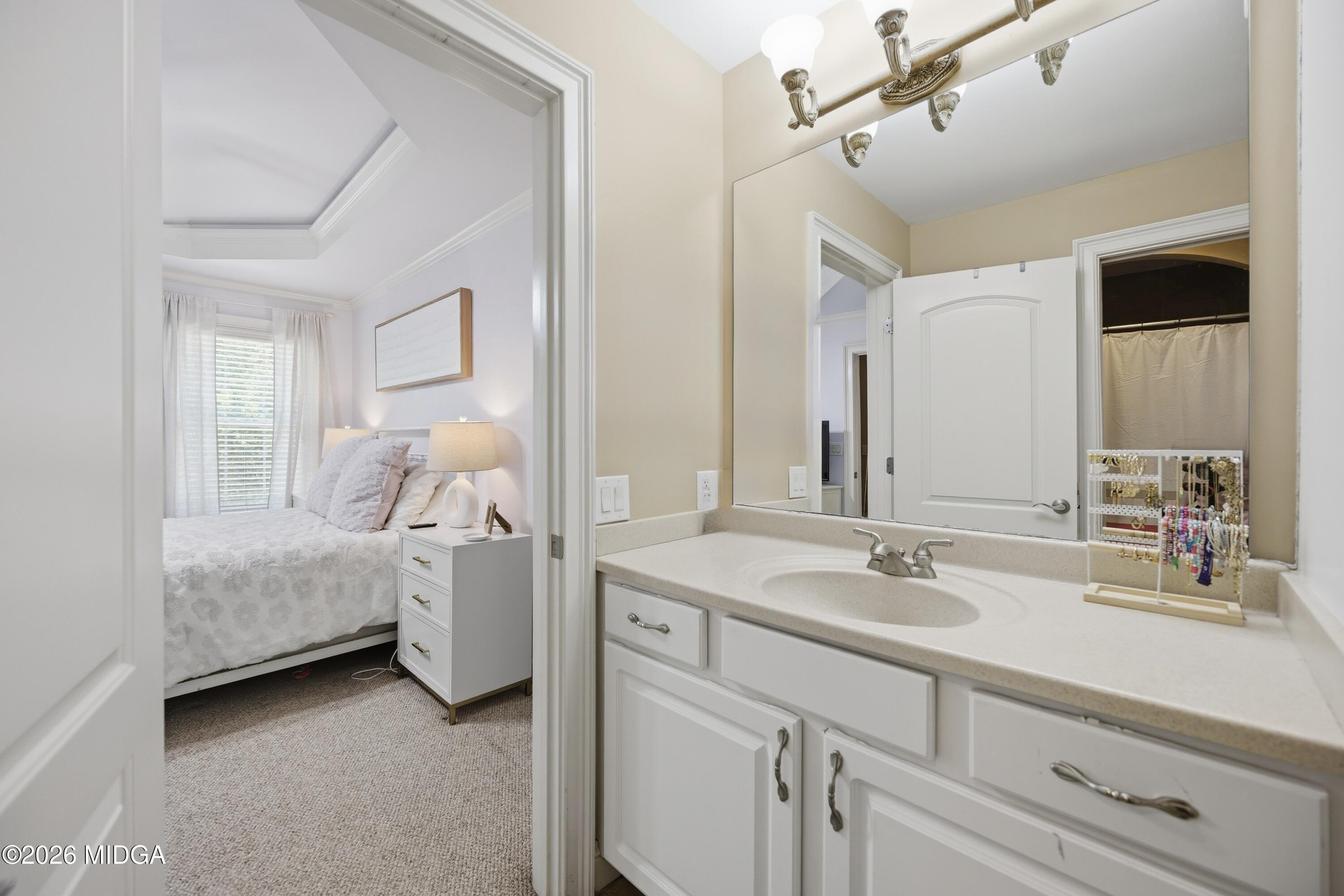 102 Tee Drive Forsyth, GA 31029 - Photo 37 of 53 a bathroom with a double vanity sink and a mirror