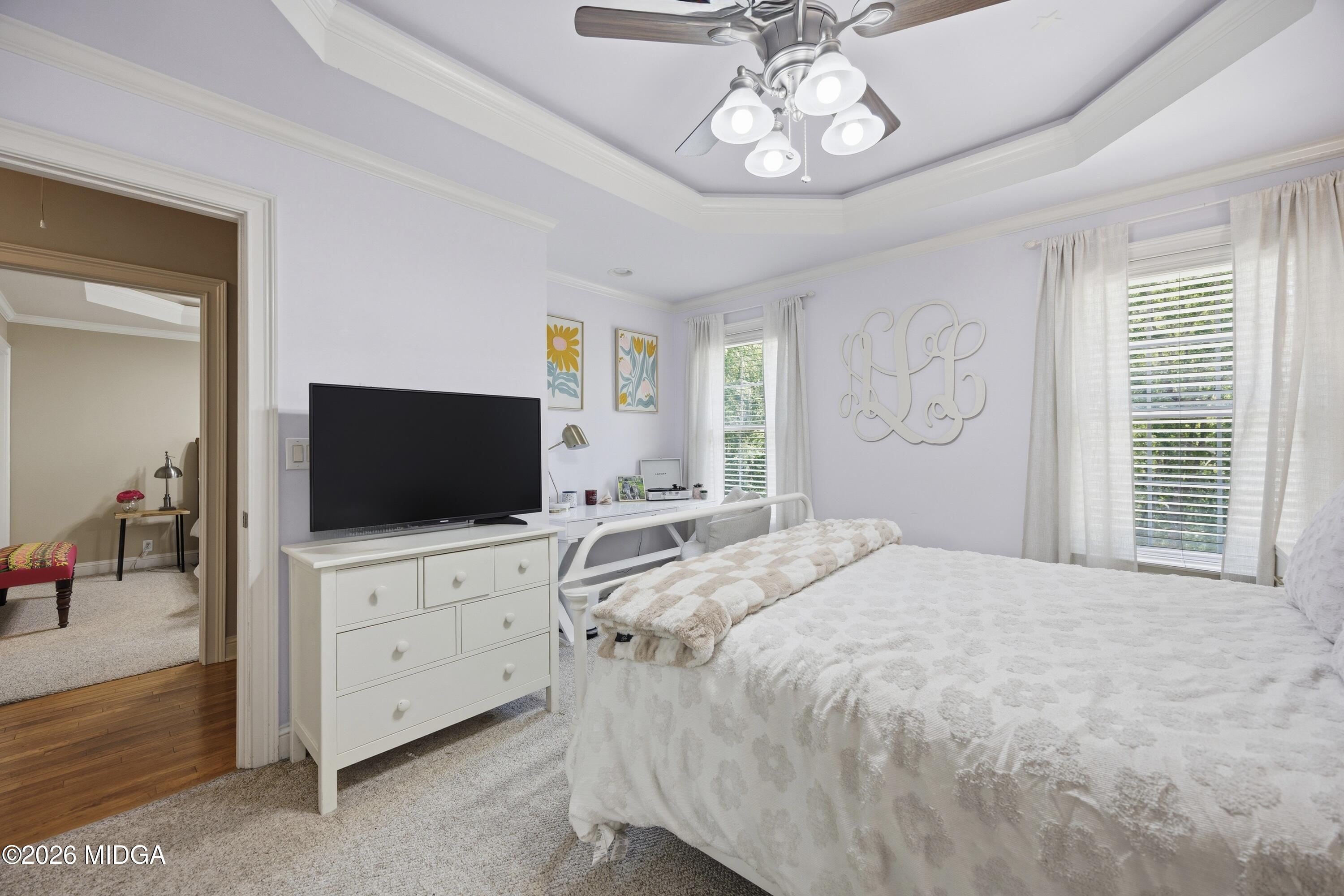 102 Tee Drive Forsyth, GA 31029 - Photo 38 of 53 a bedroom with a bed and a flat tv screen on dresser