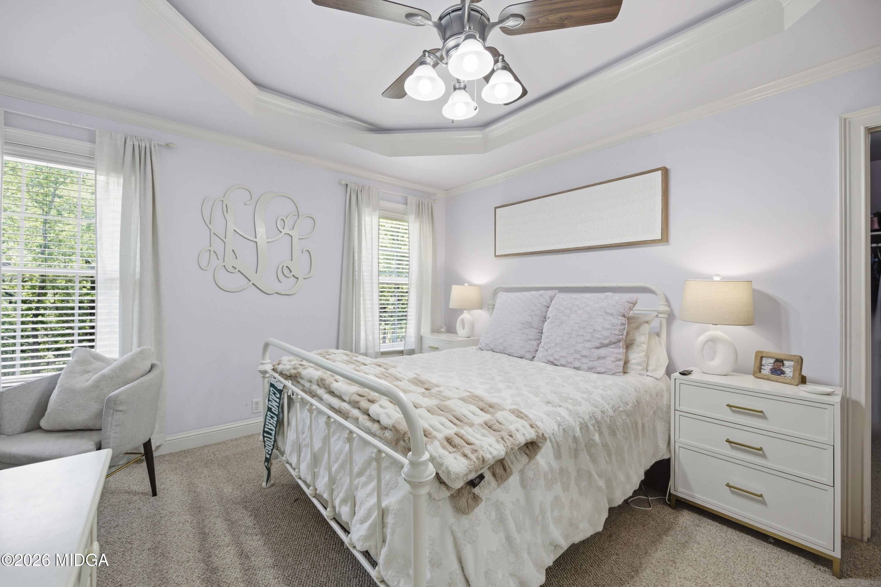 102 Tee Drive Forsyth, GA 31029 - Photo 39 of 53 a bedroom with a bed and a chandelier