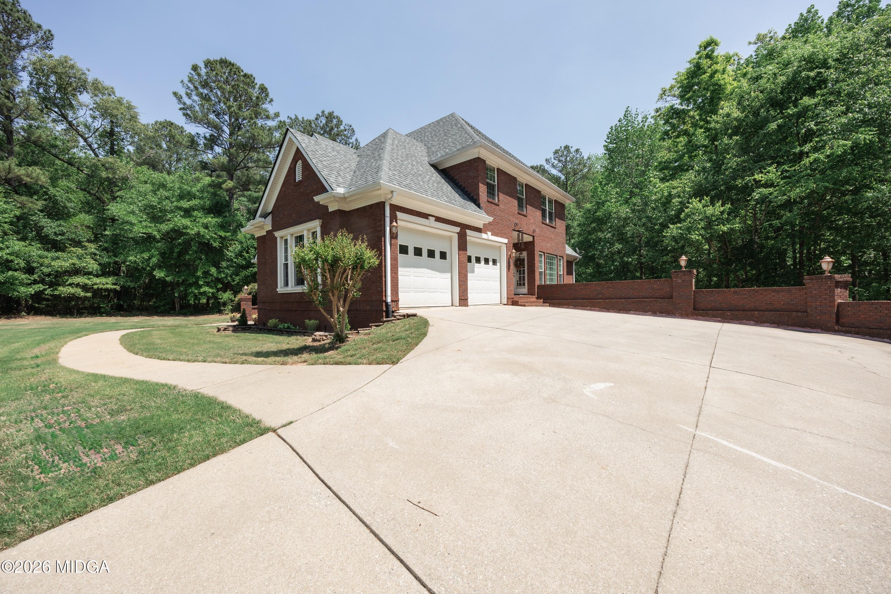 102 Tee Drive Forsyth, GA 31029 - Photo 4 of 53 a front view of a house with a yard