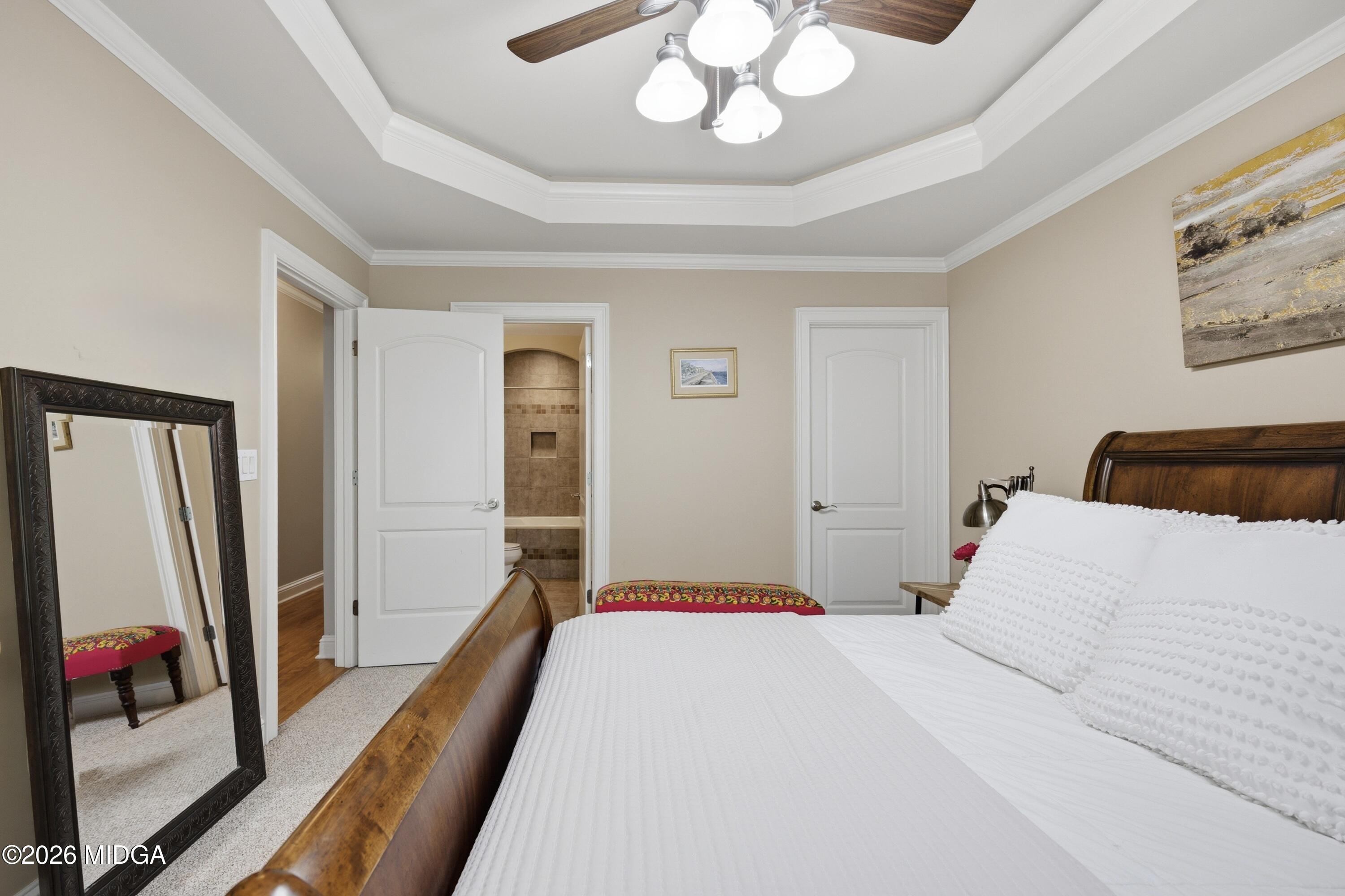 102 Tee Drive Forsyth, GA 31029 - Photo 41 of 53 a bedroom with a bed and a large mirror on the dresser