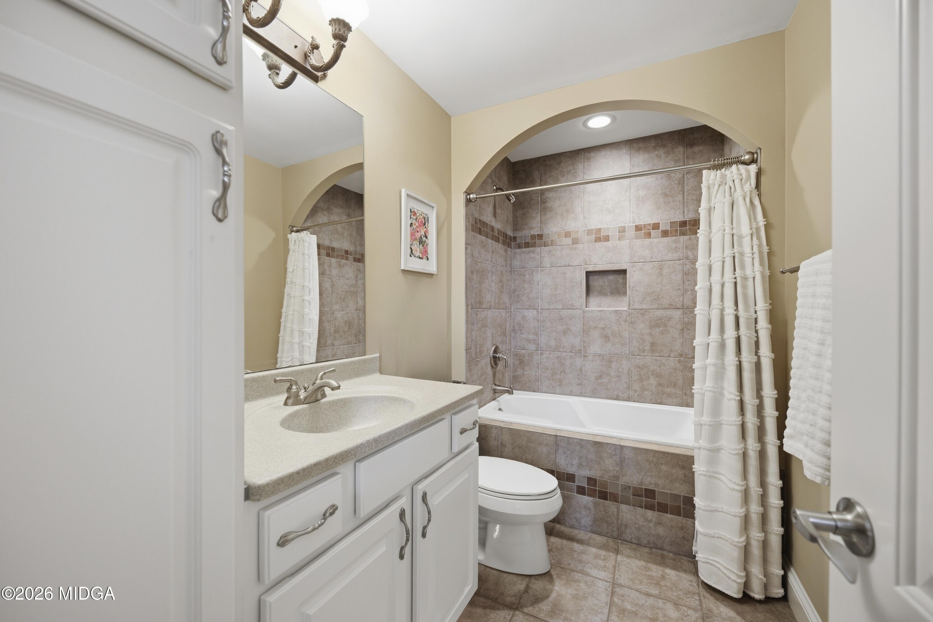 102 Tee Drive Forsyth, GA 31029 - Photo 42 of 53 a bathroom with a granite countertop sink toilet and shower