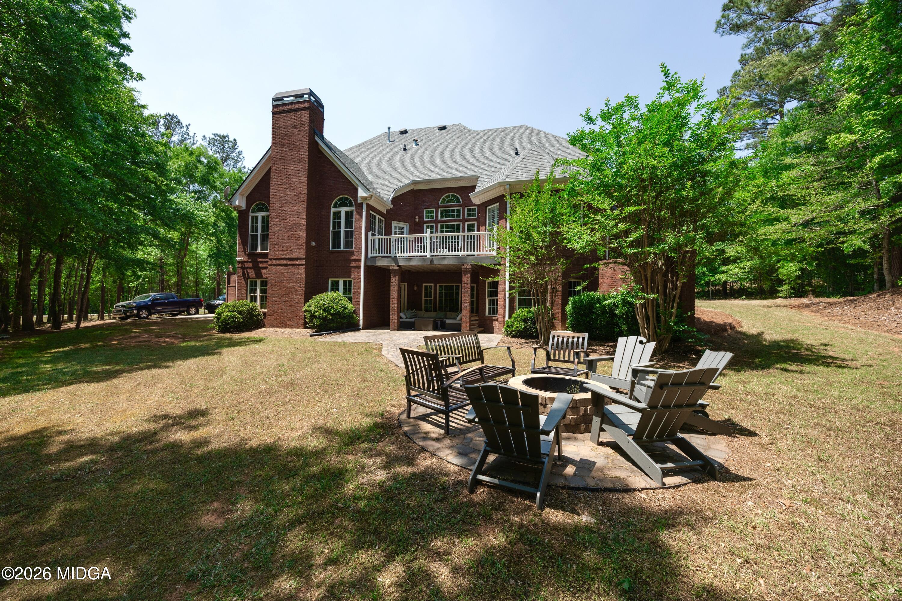 102 Tee Drive Forsyth, GA 31029 - Photo 53 of 53 a view of a house with backyard sitting area and garden