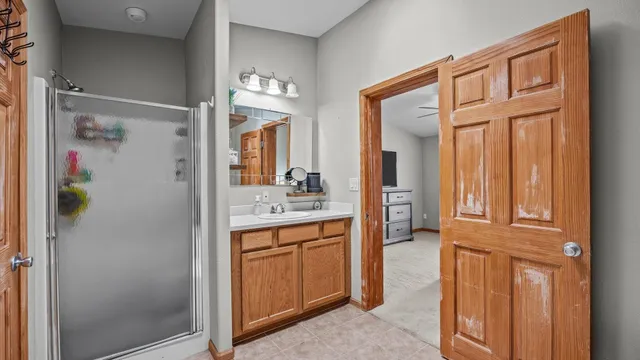 a bedroom with furniture and a window