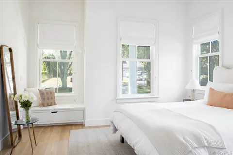 a bedroom with a large bed and a window