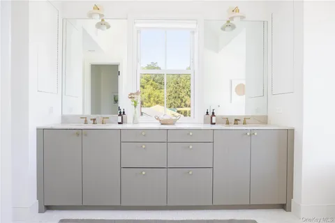 a bathroom with a bathtub and a sink