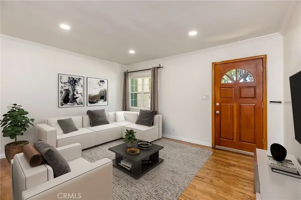 a living room with furniture rug and window