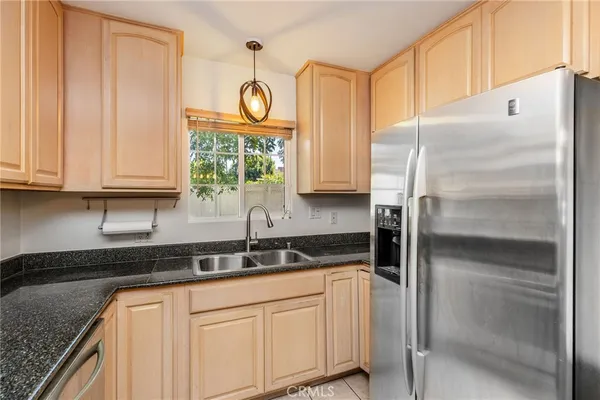 a kitchen with appliances cabinets and a sink