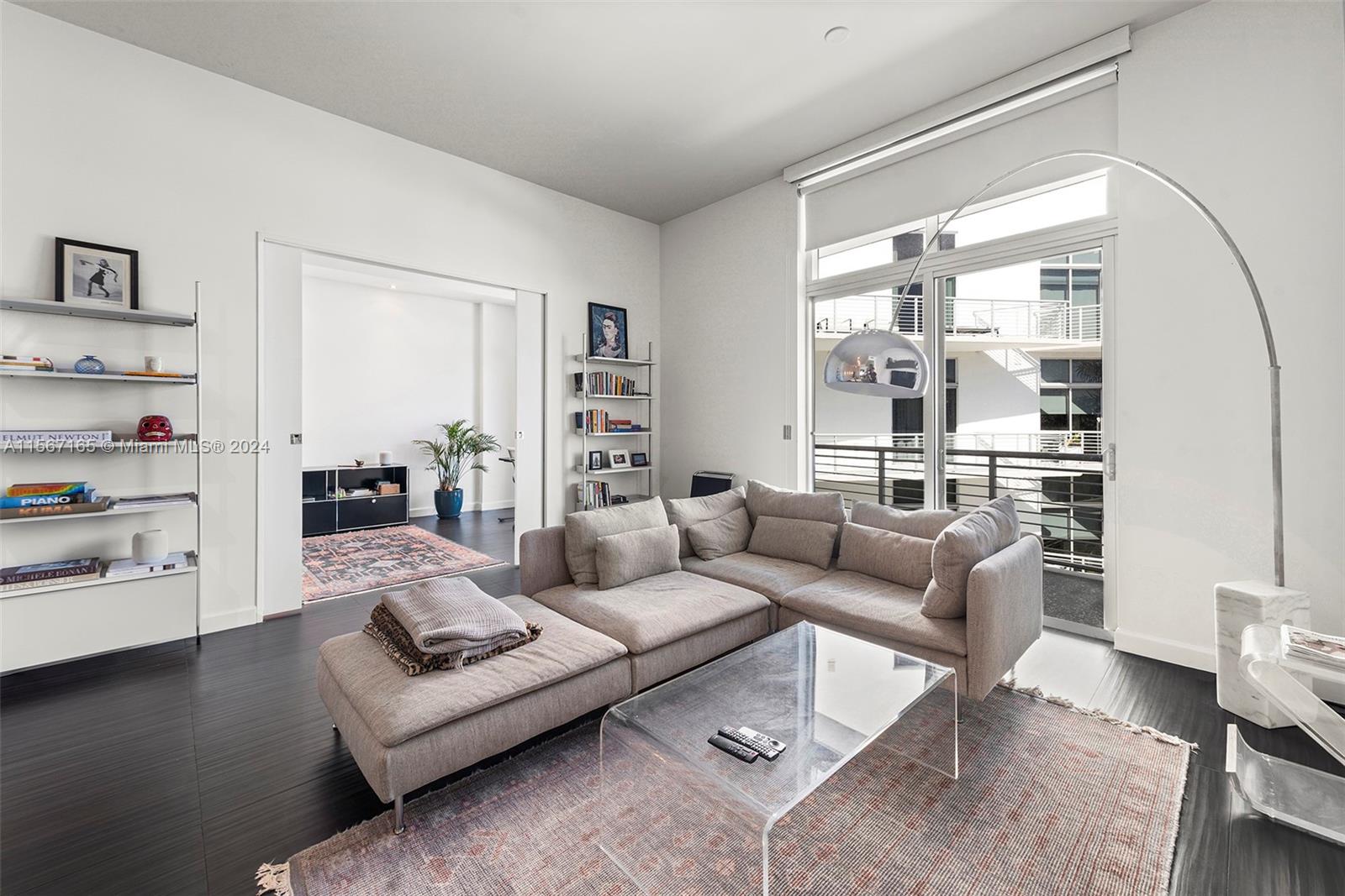2001 Meridian Avenue, Unit 517 Miami Beach, FL 33139 - Photo 7 of 28 a living room with furniture wooden floor and a large window