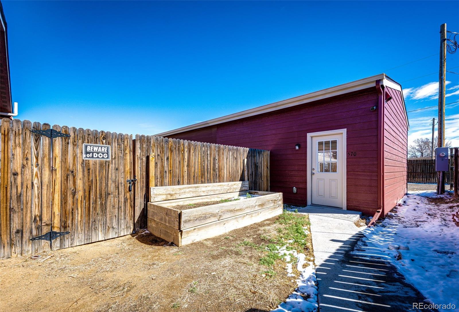 570 4th Street Bennett, CO 80102 - Photo 31 of 36 a view of a house with wooden fence and floor