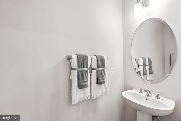 a bathroom with a sink and mirror
