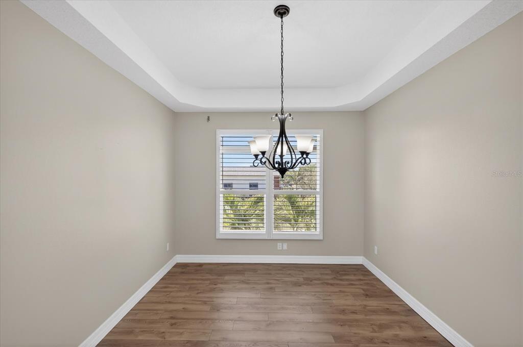3339 Seaway Drive New Port Richey, FL 34652 - Photo 11 of 74 a view of an empty room with window and chandelier