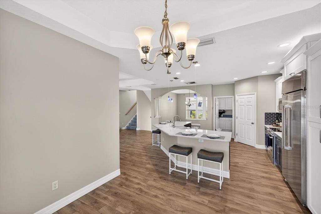 3339 Seaway Drive New Port Richey, FL 34652 - Photo 15 of 74 a view of a dining room with furniture and chandelier
