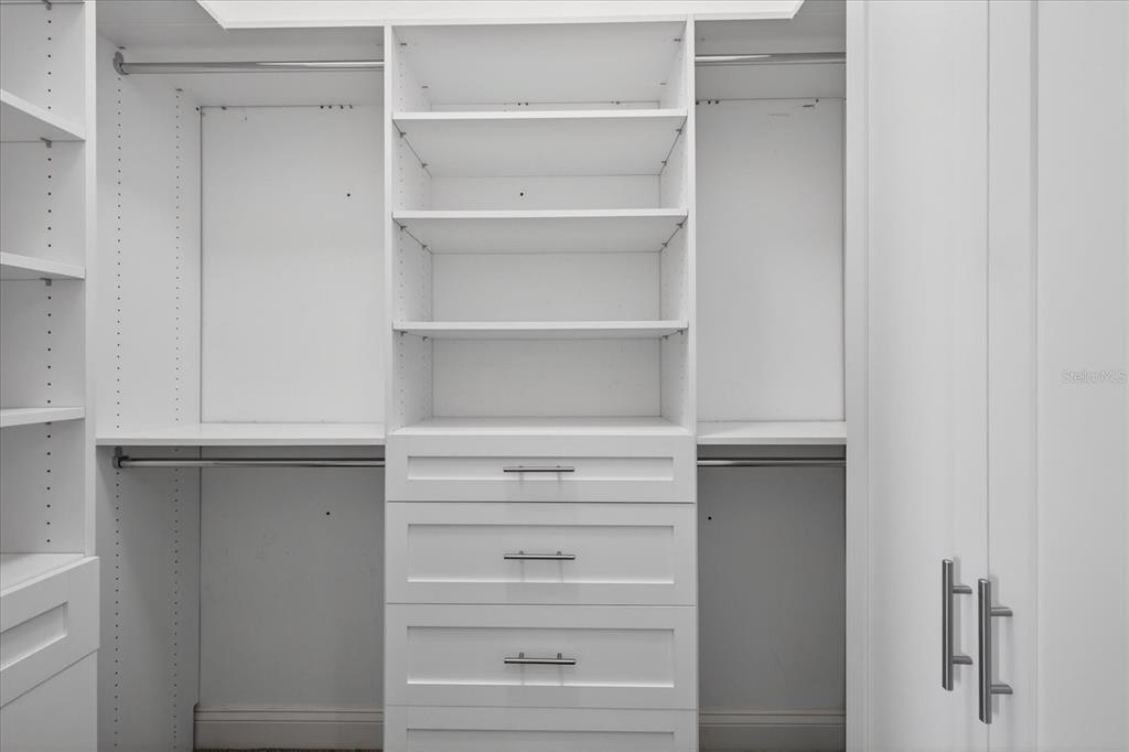 3339 Seaway Drive New Port Richey, FL 34652 - Photo 21 of 74 a view of walk in closet with empty racks