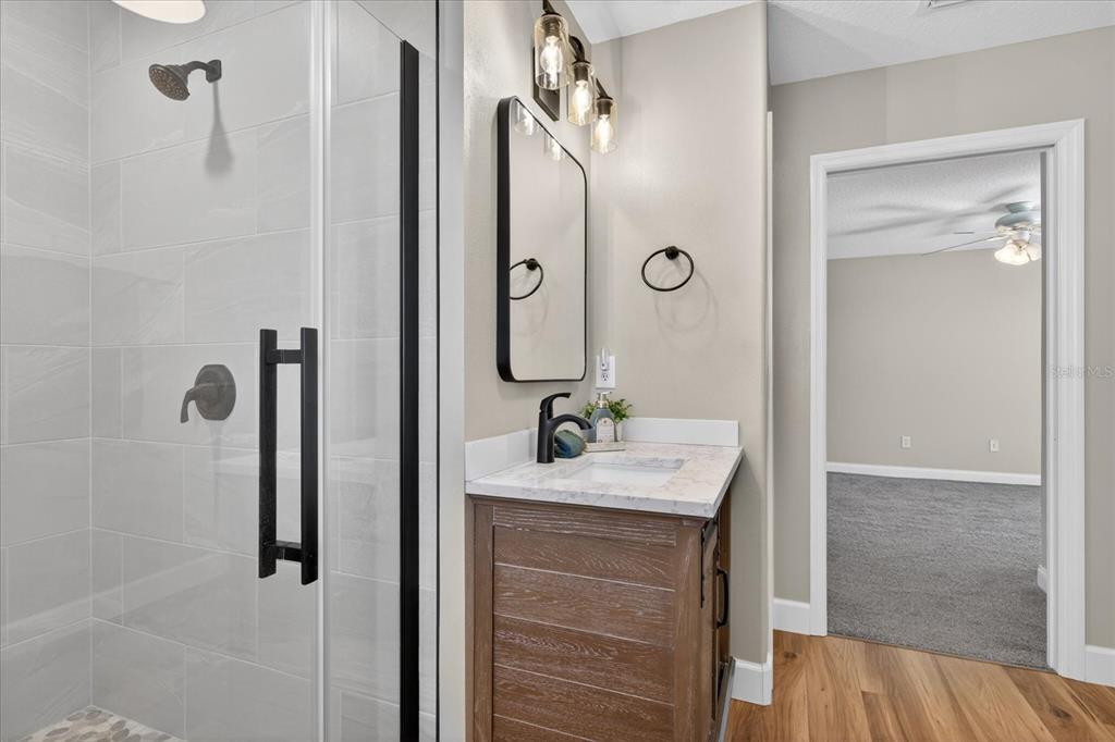 3339 Seaway Drive New Port Richey, FL 34652 - Photo 36 of 74 a bathroom with a sink vanity granite tub and shower