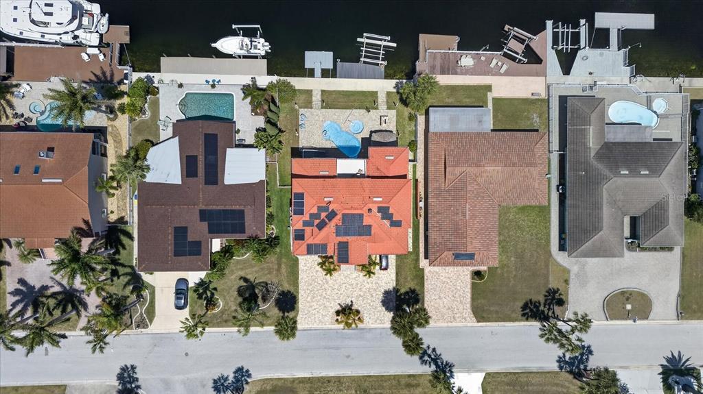 3339 Seaway Drive New Port Richey, FL 34652 - Photo 72 of 74 an aerial view of residential houses with outdoor space and parking