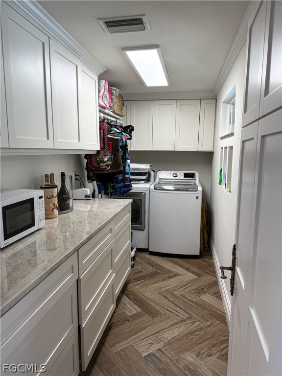4902 Esplanade Street Estero, FL 34134 - Photo 18 of 40 a kitchen with a white cabinets and white appliances