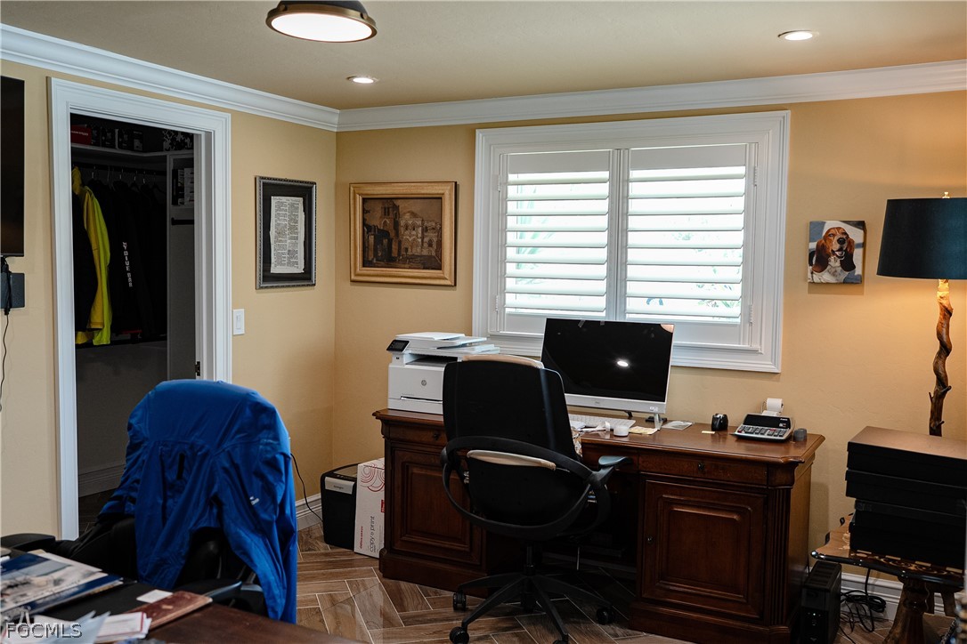 4902 Esplanade Street Estero, FL 34134 - Photo 19 of 40 a view of a workspace with furniture and a window