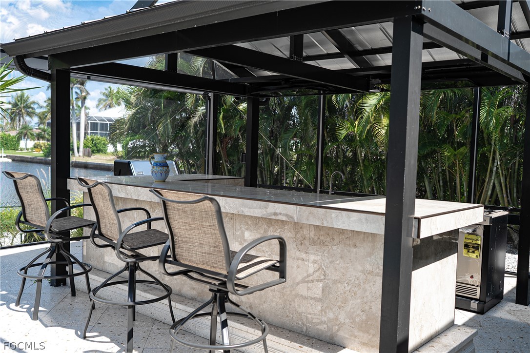 4902 Esplanade Street Estero, FL 34134 - Photo 24 of 40 a view of balcony with patio