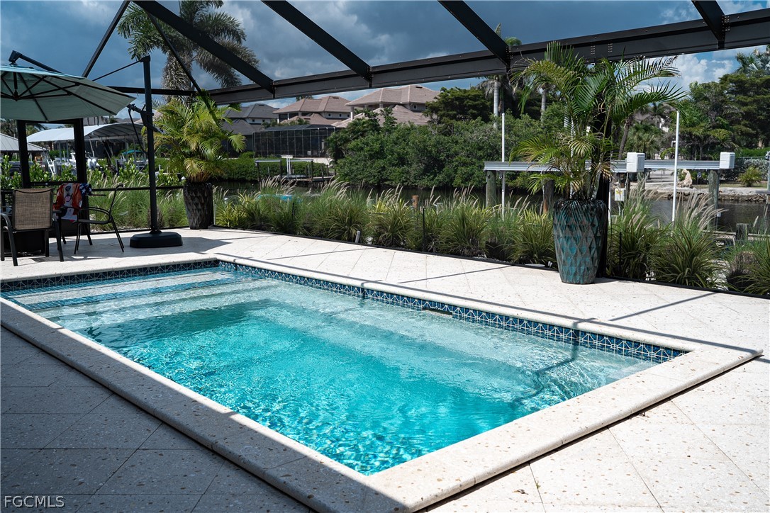 4902 Esplanade Street Estero, FL 34134 - Photo 25 of 40 a view of swimming pool from a patio