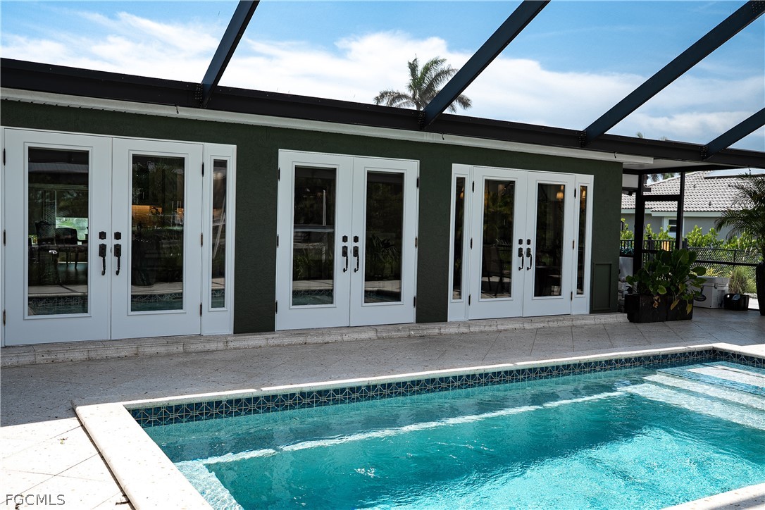 4902 Esplanade Street Estero, FL 34134 - Photo 26 of 40 front view of a brick house with a large window