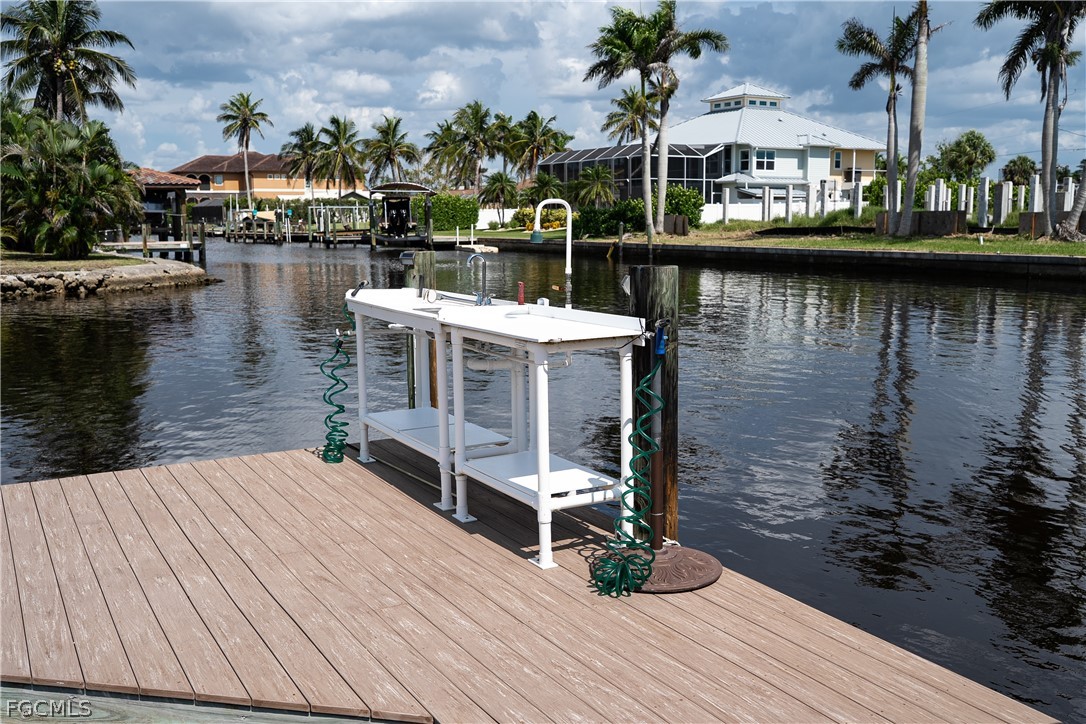 4902 Esplanade Street Estero, FL 34134 - Photo 30 of 40 a terrace with outdoor seating and lake view