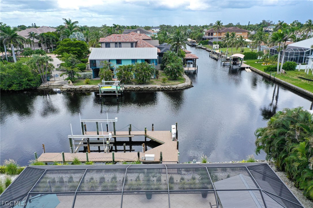 4902 Esplanade Street Estero, FL 34134 - Photo 33 of 40 a view of a lake with sitting area