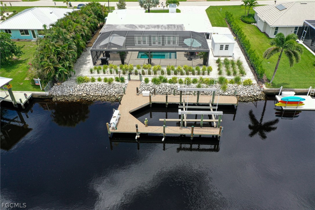 4902 Esplanade Street Estero, FL 34134 - Photo 35 of 40 an aerial view of a house with swimming pool and outdoor seating
