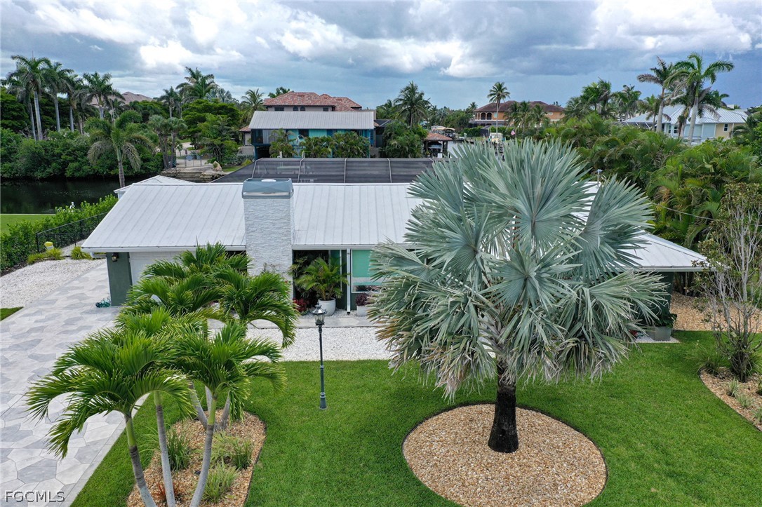 4902 Esplanade Street Estero, FL 34134 - Photo 4 of 40 a view of a garden with a fountain