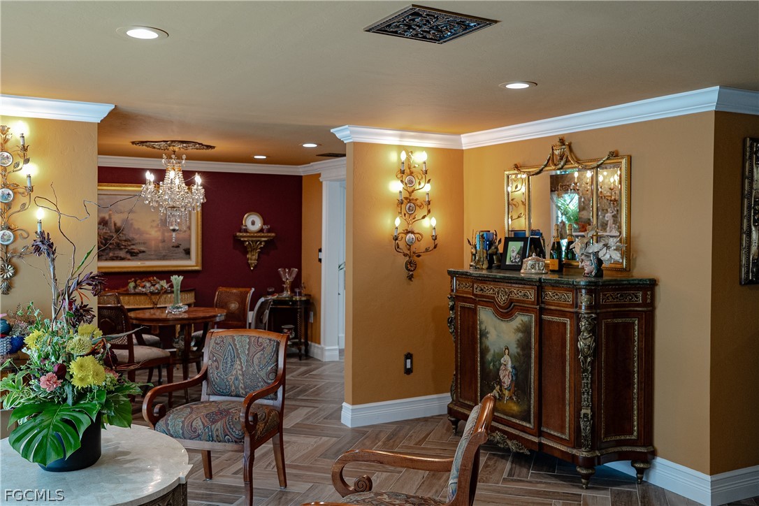 4902 Esplanade Street Estero, FL 34134 - Photo 7 of 40 a room with furniture gym equipment and entryway