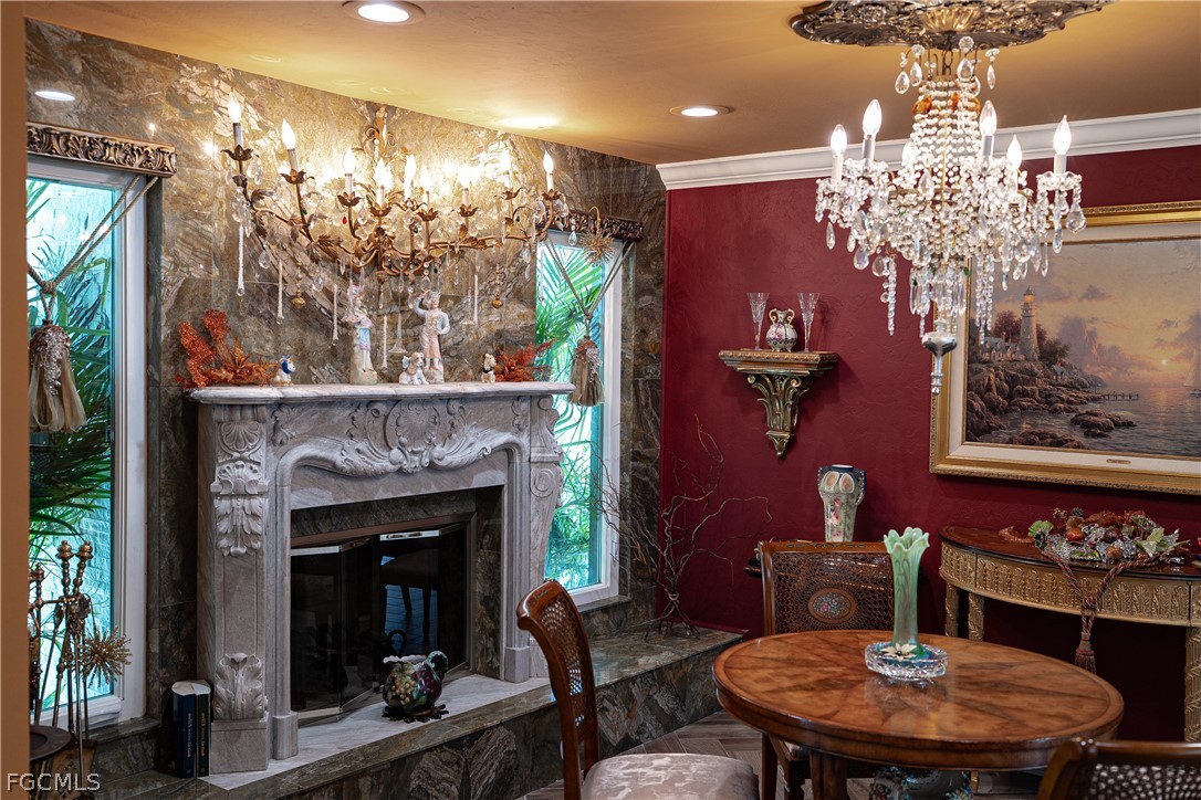 4902 Esplanade Street Estero, FL 34134 - Photo 8 of 40 a view of a dining room with furniture and chandelier