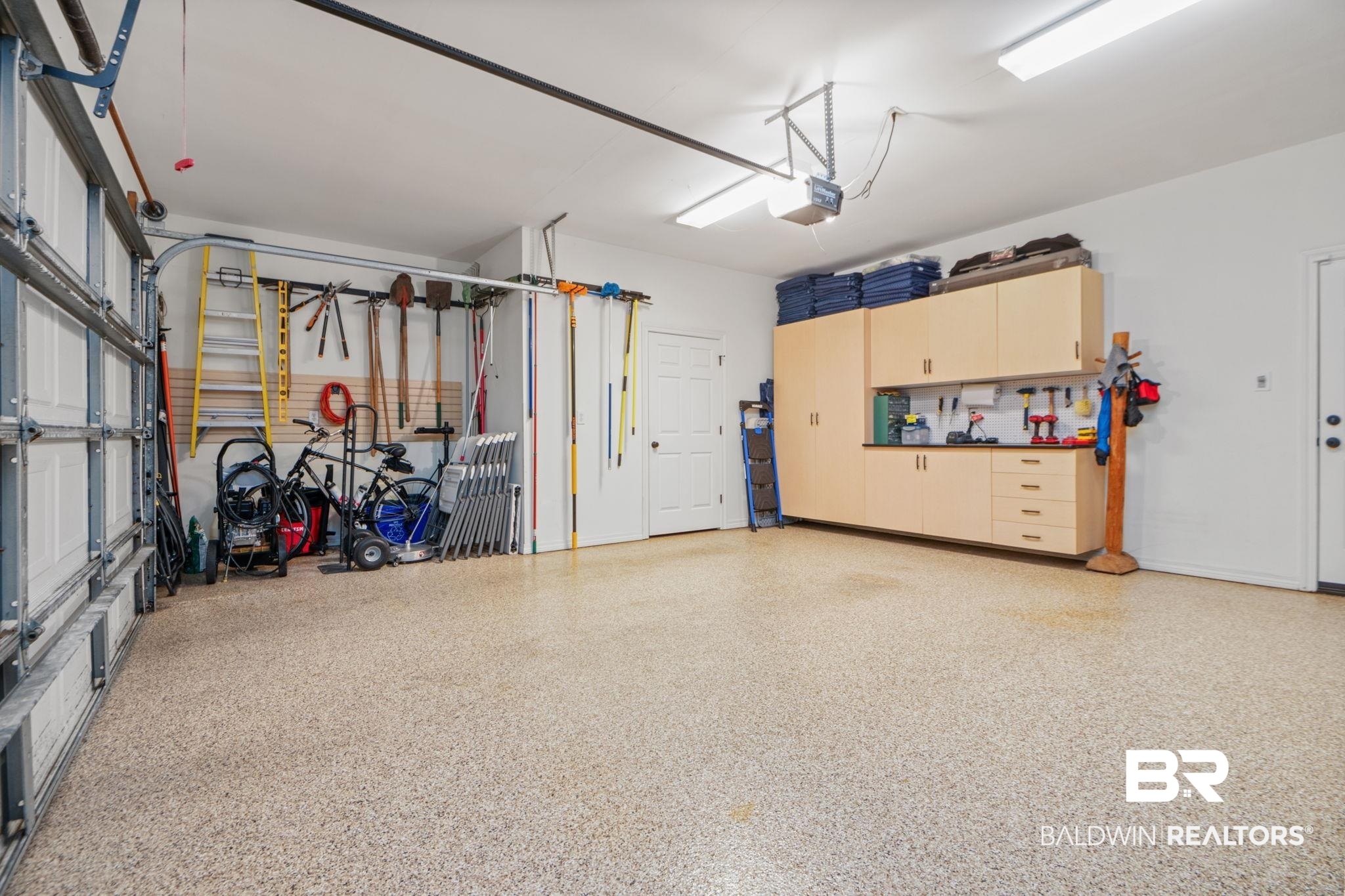 105 Beaver Dam Road Fairhope, AL 36532 - Photo 45 of 55 Garage featuring a garage door opener