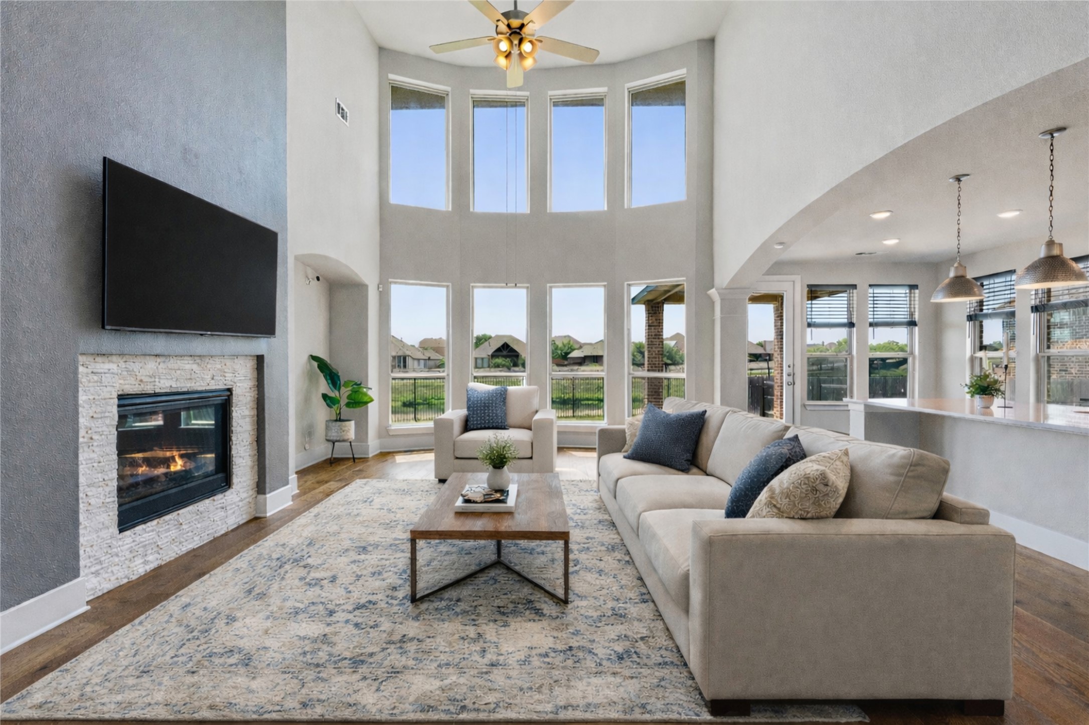 108 Rio Vista Drive Georgetown, TX 78626 - Photo 2 of 40 a living room with furniture a fireplace and a flat screen tv