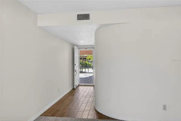 a view of a dining room with furniture wooden floor and chandelier