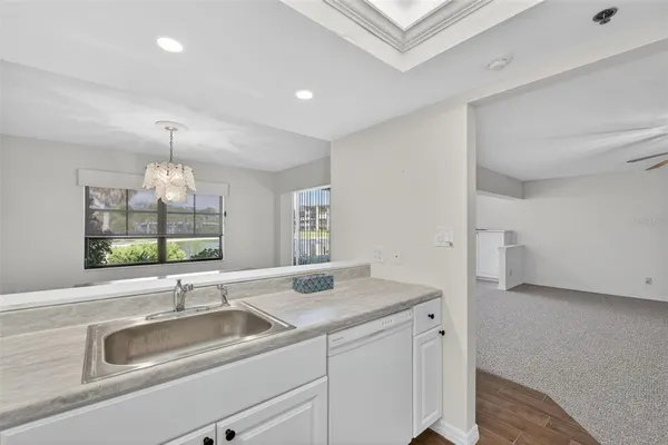 a living room with furniture and large windows