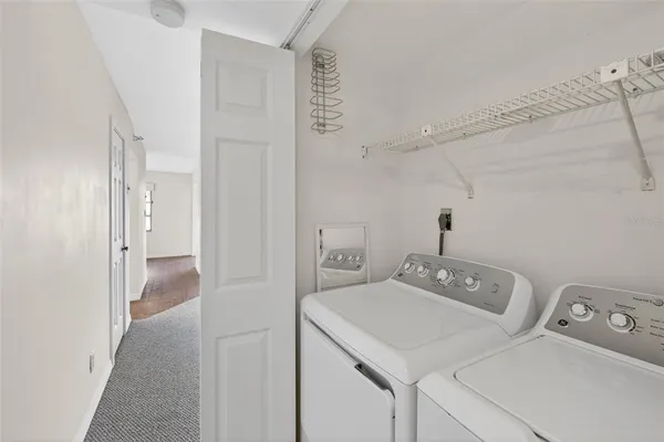 a view of a lake with a house in the background