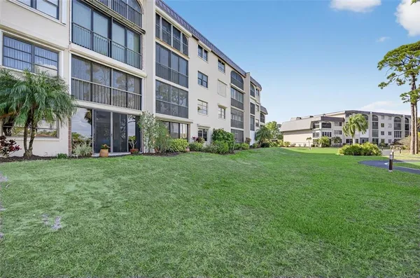 a view of a swimming pool with a table and chairs