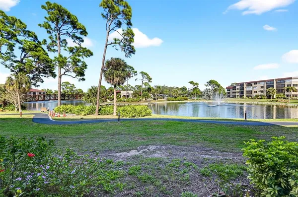 a front view of a residential apartment building with a yard