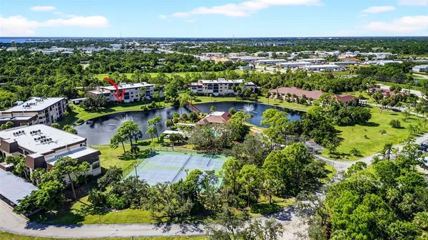 an aerial view of a house with a swimming pool