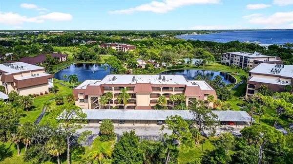 an aerial view of a house with a yard basket ball court and outdoor seating