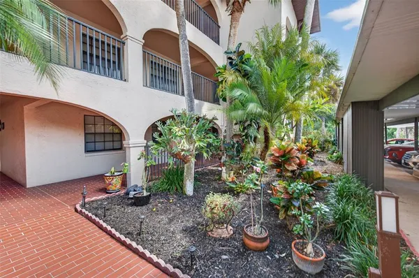 a bedroom with bed and a couch