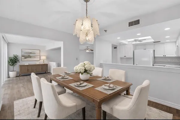 a view of a livingroom with a ceiling fan and window