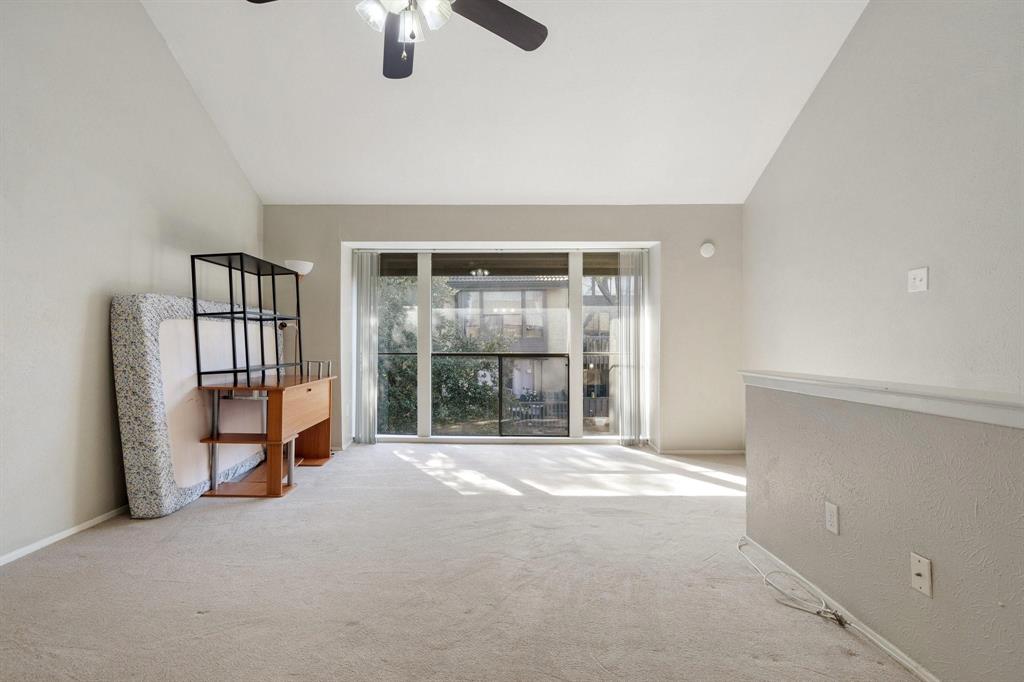 4533 North O'Connor Road, Unit 2208 Irving, TX 75062 - Photo 21 of 28 an empty room with floor to ceiling window and an ceiling fan
