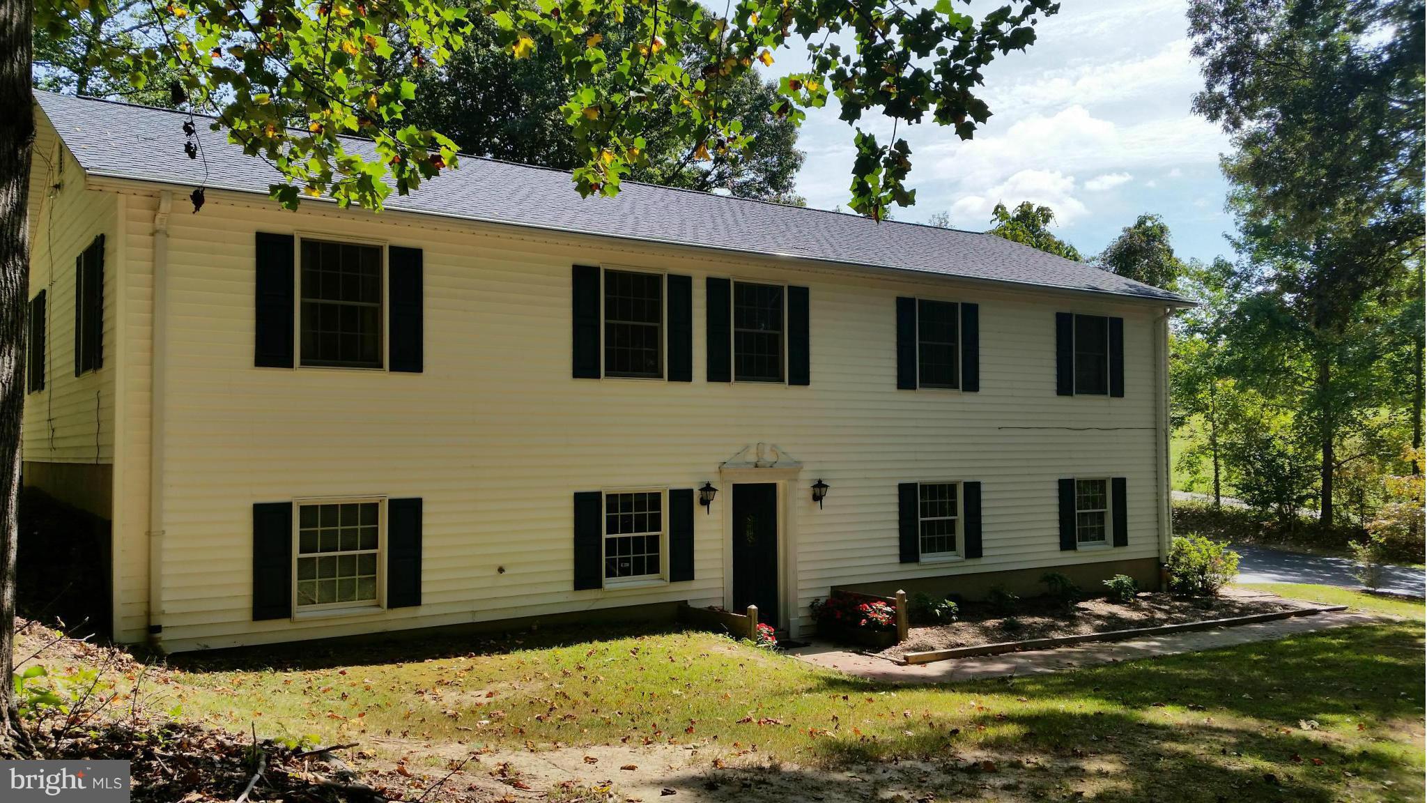 11030 Mill Bridge Road Lusby, MD 20657 - Photo 1 of 30 a front view of house with yard